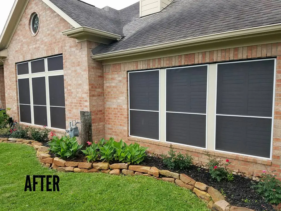 Brick house with window screens installed