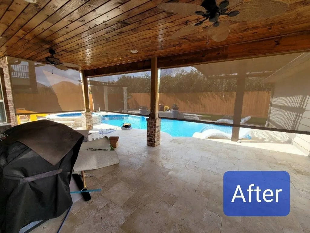 Covered patio overlooking a swimming pool